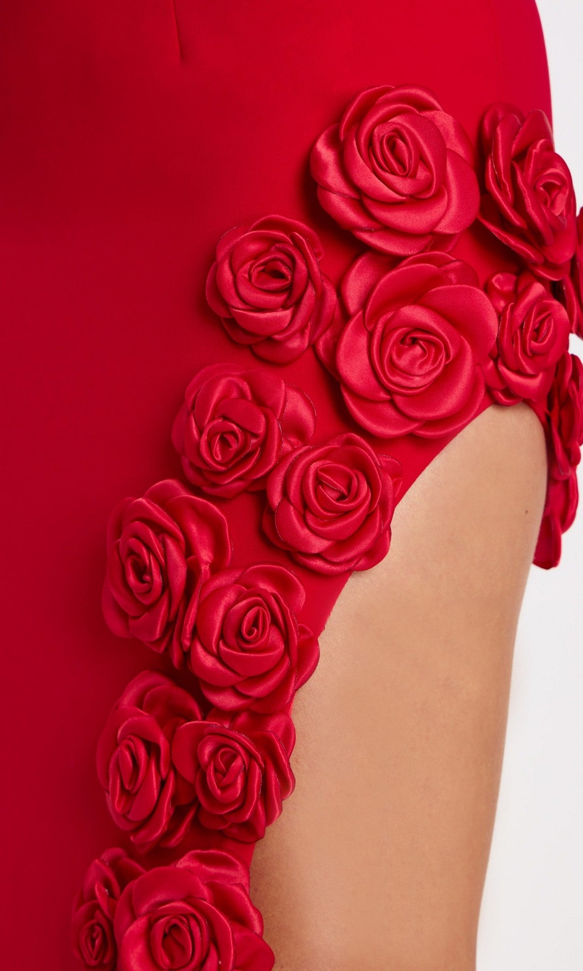 Close-up of the Jovani 47798 long prom dress, a strapless crepe gown with a fitted column silhouette and 3D fabric roses accenting the high side slit.